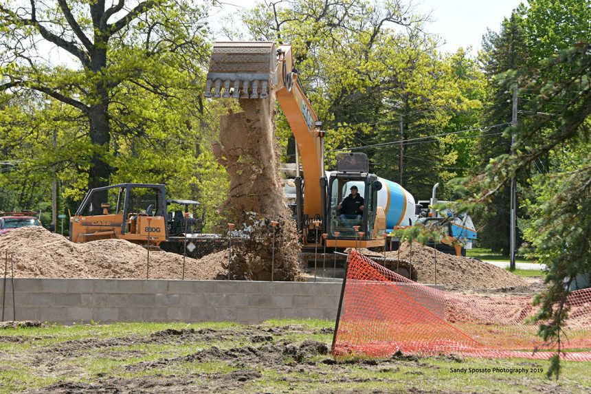 Excavator Dumping Dirt